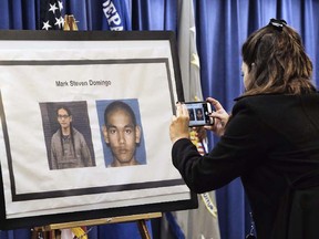 A reporter takes a photo of Mark Domingo, 26, from Reseda, Calif., displayed at a news conference in Los Angeles on Monday, April 29, 2019. ( AP Photo/Richard Vogel)