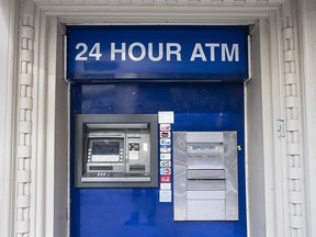 This Nov. 29, 2018, file photo shows an ATM in Philadelphia. (AP Photo/Matt Rourke, File)
