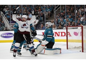 Colorado Avalanche's Gabriel Landeskog celebrates a goal against San Jose Sharks goaltender Martin Jones by teammate Tyson Barrie (not shown) in the second period of Game 2 of an NHL hockey second-round playoff series at the SAP Center in San Jose, Calif., on Sunday, April 28, 2019.