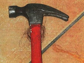 A bloody hammer is pictured in this undated police handout photo.