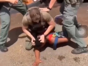 Video posted on Twitter shows a Florida deputy throw the teen to the ground, where another deputy twice slams his forehead and punches him. (Twitter)