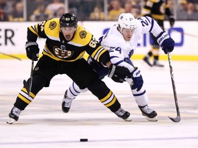 Bruins winger Brad Marchand (left) and Toronto's Kasperi Kapanen battle for the puck during the playoffs last year. Marchand is a thorn in the Maple Leafs' side almost every time the two teams play. (Maddie Meyer/Getty Images)