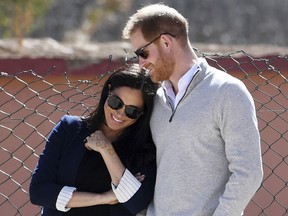 In this Sunday, Feb. 24, 2019 file photo, Britain's Prince Harry and Meghan, Duchess of Sussex, watch children playing football at a school in the town of Asni, in the Atlas mountains, Morocco.
