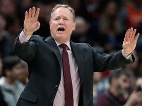 Milwaukee Bucks coach Mike Budenholzer yells instructions to players during the second half of an NBA game against the Cleveland Cavaliers, Wednesday, March 20, 2019, in Cleveland.