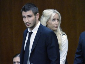 In this July 2, 2015, file photo, Los Angeles Kings' Slava Voynov enters Superior Court with his wife, Marta Varlamova, in Torrance, Calif.