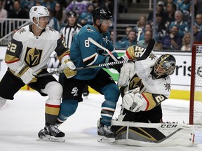 Sharks' Joe Pavelski (centre) reacts after scoring a goal against Golden Knights goalie Marc-Andre Fleury, (right) during the first period of Game 1 of an NHL first-round playoff series Wednesday, April 10, 2019, in San Jose, Calif. At left is Golden Knights defenceman Nick Holden.