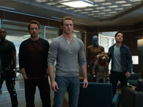 This image released by Disney shows, from left, Jeremy Renner, Don Cheadle, Robert Downey Jr., Chris Evans, Karen Gillan, the character Rocket, voiced by Bradley Cooper, Paul Rudd and Scarlett Johansson in a scene from "Avengers: Endgame."