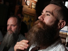 Sean Brigden, right, shows off his beard before the  3rd Annual Alberta Beard and Moustache Championships at the Palamino Smokehouse on Saturday May 27, 2017.