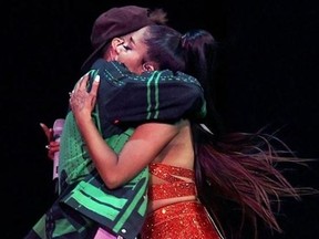 Justin Bieber hugs Ariana Grande during their Coachella appearance. (Instagram)
