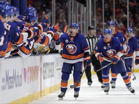New York Islanders right wing Jordan Eberle shouts as he skates by the bench after scoring a goal against the Pittsburgh Penguins during the third period of Game 2 of an NHL hockey first-round playoff series, Friday, April 12, 2019, in Uniondale, N.Y. (AP Photo/Julio Cortez)