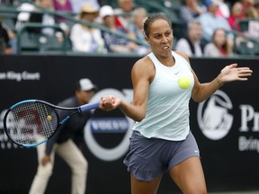 Madison Keys returns a shot to Monica Puig, from Puerto Rico, during their semifinal at the Volvo Car Open in Charleston, S.C., Saturday, April 6, 2019.
