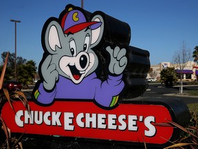 A sign for a Chuck E. Cheese restaurant is seen in this 2014 file photo.