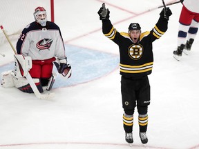 Boston Bruins centre Charlie Coyle, right, celebrates after beating Columbus Blue Jackets goaltender Sergei Bobrovsky for the game-winning goal during overtime of Game 1 of an NHL hockey second-round playoff series, Thursday, April 25, 2019, in Boston.