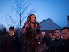 Faith Goldy who was supposed to speak at Wilfrid Laurier University but was interrupted by a fire alarm speaks outside the university on March 20, 2018.