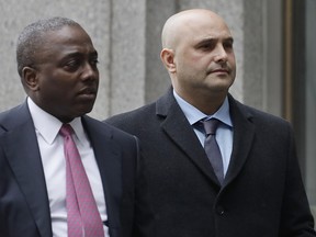 Craig Carton, right, the former co-host of a sports radio show with ex-NFL quarterback Boomer Esiason, arrives at federal court to be sentenced for defrauding investors in a ticket reselling business, Friday, April 5, 2019, in New York. (AP Photo/Mark Lennihan)