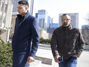 Galeeb Abau-Jabeen, left, enters court with his father after a smoke break on Thursday during his criminal negligence causing death and criminal negligence causing bodily harm trial in connection with a deadly 2016 crash on Bloor St. E. and Parliament.