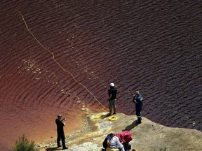 Investigators are searching for bodies with a special camera in a man-made lake near the village of Mitsero outside of the capital Nicosia, Cyprus, Saturday, April 27, 2019. Cyprus police are intensifying a search for the remains of more victims at locations where an army officer, who authorities say admitted to killing five women and two girls had dumped their bodies.