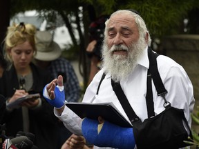 Rabbi Yisroel Goldstein speaks at a news conference at the Chabad of Poway synagogue, Sunday, April 28, 2019, in Poway, Calif. (AP Photo/Denis Poroy)