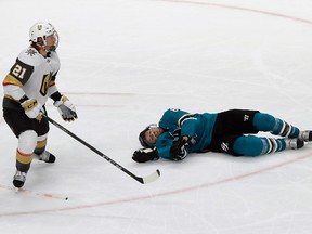 San Jose Sharks centre Joe Pavelski, right, lies on the ice next to Vegas Golden Knights center Cody Eakin during the third period of Game 7 of an NHL hockey first-round playoff series in San Jose, Calif., Tuesday, April 23, 2019.