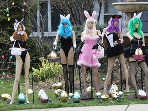 In this April, 8, 2019, file photo, a lawn display outside a dental office in Clifton, N.J., shows five mannequins dressed in lingerie, all holding Easter baskets and surrounded by Easter eggs.