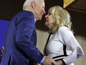 Former vice-president and Democratic presidential candidate Joe Biden, left, is welcomed to the stage by wife Jill, before addressing a rally at the Teamster Local 249 Hall in Pittsburgh, Monday, April 29, 2019.