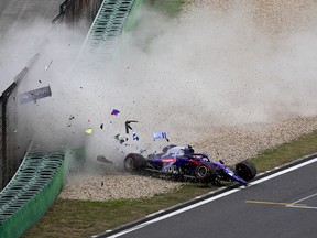 In this photo provided by Cheung Yuk Ling, Toro Rosso driver Alexander Albon of Thailand crashes his car during the third practice session for the Chinese Formula One Grand Prix at the Shanghai International Circuit in Shanghai, China, Saturday, April 13, 2019.