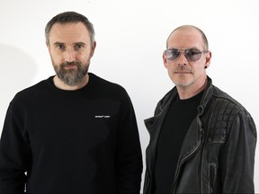 This April 12, 2019 photo shows musicians Noel Hogan, left, and Fergal Lawler, of the rock group The Cranberries, posing for a portrait in New York to promote their eighth and final album, “In the End.” (Andy Kropa/Invision/AP)