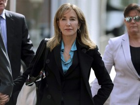 Actress Felicity Huffman arrives at federal court in Boston to face charges in a nationwide college admissions bribery scandal on April 3, 2019.