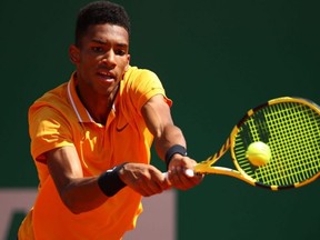 Felix Auger-Aliassime plays a backhand against Alexander Zverev during the Rolex Monte-Carlo Masters at Monte-Carlo Country Club in Monaco, on April 17, 2019.