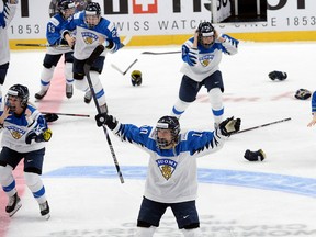 Finnish players celebrate a game-winning overtime goal which was later disallowed during the IIHF Women's World Championship final against the United States in Espoo, Finland, on Sunday, April 14, 2019. (Mikko Stig/Lehtikuva via AP)