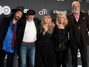 Inductee Stevie Nicks, centre, poses with other members of Fleetwood Mac, from left, Mike Campbell, John McVie, Christine McVie and Mick Fleetwood at the Rock & Roll Hall of Fame induction ceremony in New York on March 29, 2019.
