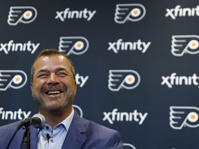 Alain Vigneault, newly hired Philadelphia Flyers head coach, smiles while speaking to the media during an introductory press conference at the Flyer's NHL hockey practice facility, Thursday, April 18, 2019, in Voorhees, N.J.