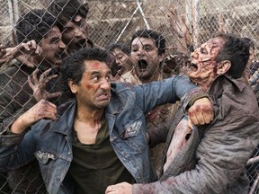 Cliff Curtis and zombies in a scene from Season 3 of Fear the Walking Dead. Courtesy, AMC.