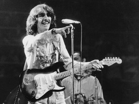 George Harrison interacts with the crowd at a concert in Toronto in December, 1974.