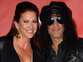 Slash and Perla Hudson attend the 10th annual MusiCares MAP Fund Benefit Concert at Club Nokia on May 12, 2014 in Los Angeles, Calif.  (Frazer Harrison/Getty Images)
