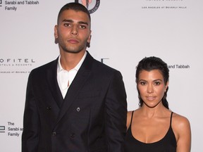 Younes Bendjima, left, and Kourtney Kardashian arrive for The Syrian American Medical Society hosts the Voices in Displacement Gala at Riviera 31 at Sofitel on May 4, 2018 in Los Angeles, Calif.  (Gabriel Olsen/Getty Images)