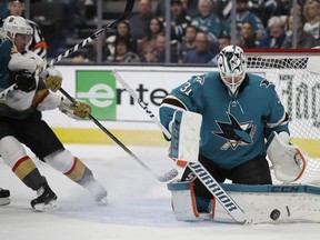 San Jose Sharks goalie Martin Jones, right, blocks a shot from the Vegas Golden Knights during the second period of Game 5 of an NHL hockey first-round playoff series Thursday, April 18, 2019, in San Jose, Calif.