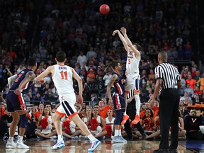 Kyle Guy of the Virginia Cavaliers attempts a three-point basket in the second half against the Auburn Tigers during the 2019 NCAA Final Four semifinal at U.S. Bank Stadium on April 6, 2019 in Minneapolis.