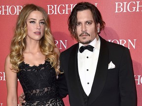 In this Jan. 2, 2016, file photo, Amber Heard, left, and Johnny Depp arrive at the 27th annual Palm Springs International Film Festival Awards Gala in Palm Springs, Calif.
