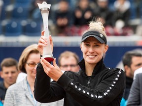 Slovenia's Polona Hercog poses with her trophy after winning the Final against Poland's Iga Swiatek, at the Wilcards Samsung Open 2019 WTA tennis tournament in Lugano, Switzerland, Sunday, April 14, 2019.
