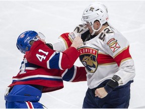Canadiens' Paul Byron  fights with Florida Panthers defenceman MacKenzie Weegar on March 26, 2019, in Montreal.
