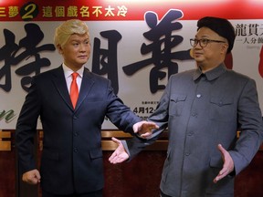 In this March 1, 2019, file photo, Hong Kong actors Chan Hung-chun, right, and Loong Koon-tin, dressed as North Korean leader Kim Jong Un and U.S. President Donald Trump, pose during a press conference to promote their upcoming Chinese opera "Trump on Show" in Hong Kong.