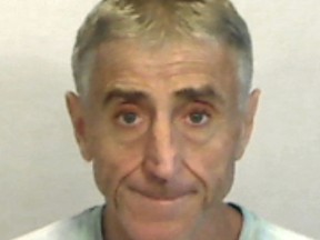 In this April 6, 2019, photo made available by the Monroe County Sheriff's Office, Fla., shows Francis Lippi under arrest. Key West police said Lippi was arrested on a felony charge of grand theft. Lippi recently bought an $8 million island off Key West. He is accused in a scheme to steal $300 in household items from Kmart. (Monroe County Sheriff's Office via AP)