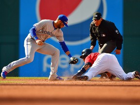 Toronto Blue Jays second baseman Lourdes Gurriel Jr. is late tagging Jose Ramirez of the Cleveland Indians on a stolen base during the third inning at Progressive Field on April 6, 2019 in Cleveland, Ohio.