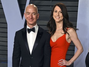 In this March 4, 2018 file photo, Jeff Bezos and wife MacKenzie Bezos arrive at the Vanity Fair Oscar Party in Beverly Hills, Calif.