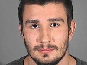 This Monday, Oct. 20, 2014 police booking photo provided by the Redondo Beach Police Department shows Los Angeles Kings' defenseman Slava Voynov. The NHL suspended Voynov indefinitely Monday, after the two-time Stanley Cup winner's arrest on suspicion of domestic violence. The 24-year-old posted $50,000 bail. (AP Photo/Redondo Beach Police Department)