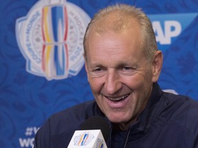 Team Europe head coach Ralph Krueger smiles as he responds to reporters questions at a news conference after the first practice session in preparation for the World Cup of Hockey tournament, Monday, Sept. 5, 2016 at the Videotron Centre in Quebec City.
