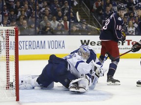 Tampa Bay Lightning's Andrei Vasilevskiy, left, of Russia, gives up a goal as Columbus Blue Jackets' Pierre-Luc Dubois, centre, and Josh Anderson watch the play during Sunday, April 14, 2019, in Columbus, Ohio.