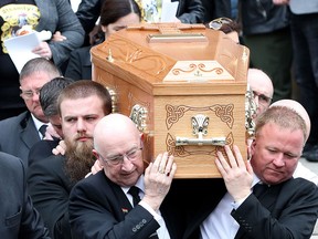 Pallbearers carry the coffin of journalist Lyra McKee, killed by a dissident republican paramilitary in Northern Ireland on April 18, as they leave St Anne's Cathedral in Belfast on April 24, 2019, following her funeral service. (PAUL FAITH/AFP/Getty Images)