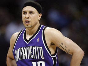 In this April 4, 2007, file photo, Sacramento Kings guard Mike Bibby stands on the court as time runs out during an NBA game against the Denver Nuggets in Denver. (AP Photo/David Zalubowski, File)